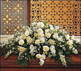 Pure White Casket Spray from Maplehurst Florist, local flower shop in Essex Junction